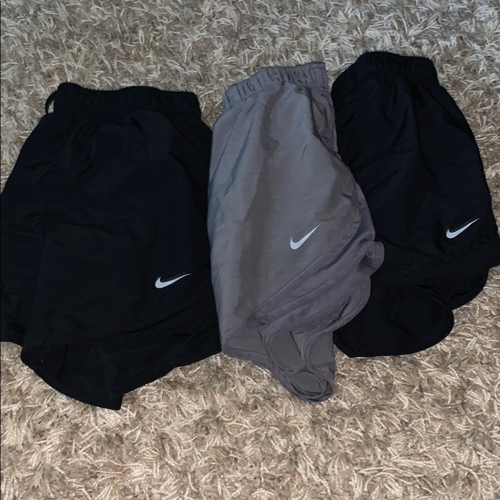 3 pairs of Nike shorts (2 black and 1 light gray)